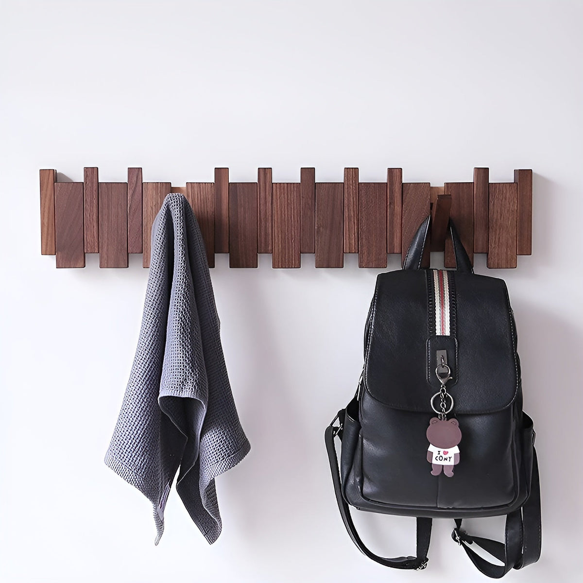 Wooden wall hooks with folding pegs