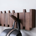 Wooden wall hooks with folding pegs